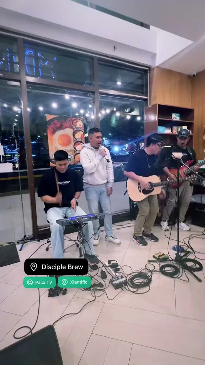 Musicians leading praise with guitars and keyboard at a Disciple Brew Fellowship Night